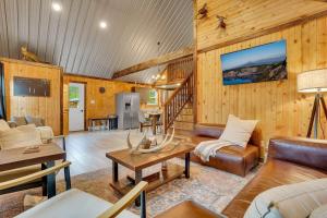 a living room with a couch and a table at The Elk Camp in Benezette