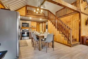 a dining room and kitchen with a table and chairs at The Elk Camp in Benezette