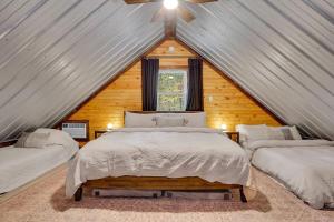 a bedroom with two beds in a attic at The Elk Camp in Benezette