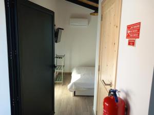 Postel nebo postele na pokoji v ubytování Studio Zambujinha