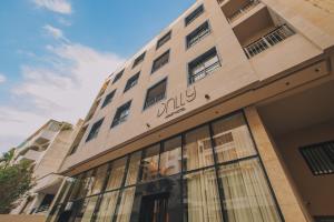 a building with the julius sign on it at Dally Apart Hotel in Rabat