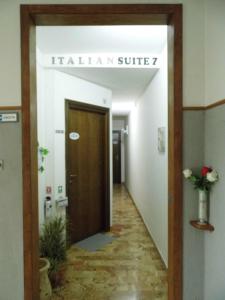 a hallway of an office with a hallway suite door at Suite 7 &Home Restaurant in Paglieta