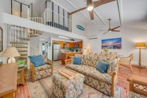a living room with a couch and a table at Koa Resort 3J · KOA 3J Remodeled 3BD w AC Pool Near Sandy Beach in Kihei