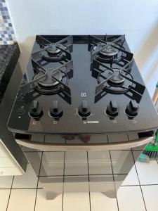 a black stove top oven in a kitchen at Ametista 2 Beira Mar in Maceió +21 photos