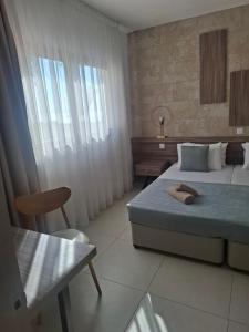 Ένα ή περισσότερα κρεβάτια σε δωμάτιο στο Electra Beach Holiday Village