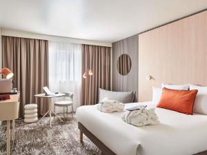 Ένα ή περισσότερα κρεβάτια σε δωμάτιο στο Novotel Paris 13 Porte d'Italie +128 φωτογραφίες