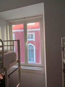 Ένα ή περισσότερα κρεβάτια σε δωμάτιο στο Welcome Hostel