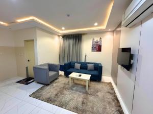 Posezení v ubytování نوفل للشقق المخدومة