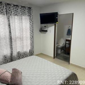 Et tv og/eller underholdning på Espectacular apto cerca a la Zona Rosa