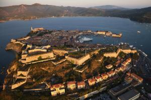an aerial view of a small island in the water at Tra Tetti e Mare - HelloElba in Portoferraio