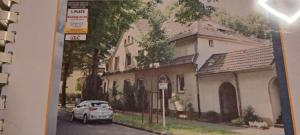 a drawing of a car parked in front of a house at Schneeglöckchen in Marl