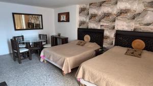 Voodi või voodid majutusasutuse Suite en torres gemelas con vista al mar toas +33 fotot