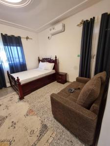 Giường trong phòng chung tại Shalom Residence