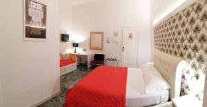 Postel nebo postele na pokoji v ubytování B&B Abatjour - ambiente sanificato - test antilegionella assolto