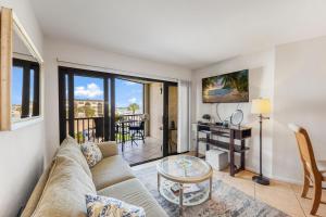 a living room with a couch and a table at Pleasant condo with spectacular views, pools and spas in Marco Island