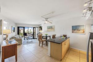 a living room with a kitchen and a dining room at Pleasant condo with spectacular views, pools and spas in Marco Island