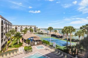 an aerial view of a resort with two tennis courts at Pleasant condo with spectacular views, pools and spas in Marco Island