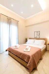 Ένα ή περισσότερα κρεβάτια σε δωμάτιο στο Acropolis Gem