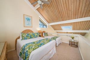 a bedroom with a bed and a wooden ceiling at Kahana Village 2 · KHV 2 Direct Oceanfront 2BD Condo Steps to Be in Kahana
