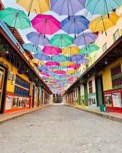a bunch of umbrellas hanging over a street at Aparta Suites Torre de Prado 601 Apartamento para 9 Personas in Medellín