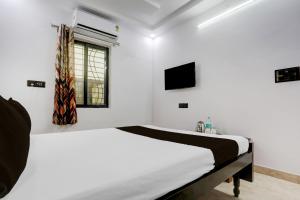 Postel nebo postele na pokoji v ubytování Hotel O Swarun and Banquet Hall Gulzarbagh Station Bus Stop