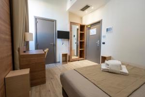 Ένα ή περισσότερα κρεβάτια σε δωμάτιο στο Casa per Ferie Santa Maria alle Fornaci