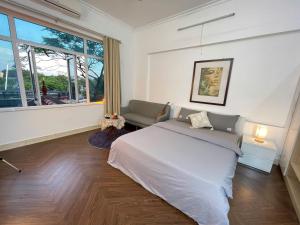 a bedroom with a large bed and a window at CHILLING SUDIO 11 Trinh Cong Son close Ho Tay vs Lotte mail ! in Hanoi
