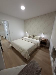 Ένα ή περισσότερα κρεβάτια σε δωμάτιο στο Casa Cuca O Grove