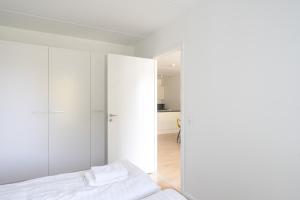 Ένα ή περισσότερα κρεβάτια σε δωμάτιο στο Spacious 2-BR w a balcony by Odense harbour - 92 +5 φωτογραφίες