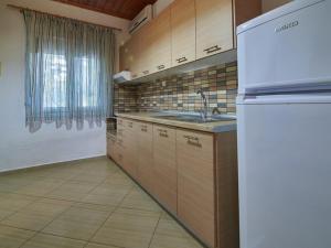 Kuchyň nebo kuchyňský kout v ubytování Toroni Dreams + 56 fotografií