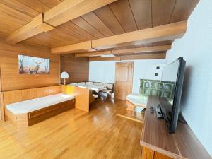 a living room with a bed and a couch at Apartment Tirol #Spielanger Hof# in Weer