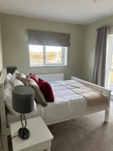 Ένα ή περισσότερα κρεβάτια σε δωμάτιο στο Bright Dundalk Homestay