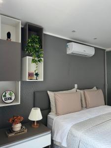 Ένα ή περισσότερα κρεβάτια σε δωμάτιο στο APART HOTEL MANAÍRA PALACE +22 φωτογραφίες