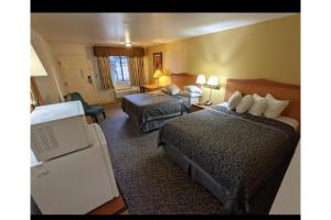 Postel nebo postele na pokoji v ubytování Sierra Inn Capital O ft Huachuca