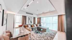 a living room with a couch and a table at Royal Home in Abu Dhabi