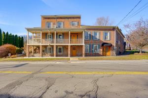 a large brick house on the corner of a street at Walk to Athens Riverfront Park! Modern-Retro Apt in Athens