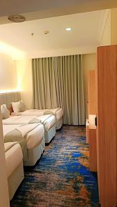 Postel nebo postele na pokoji v ubytování فندق برج دانة