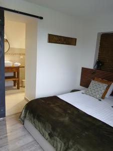 Postel nebo postele na pokoji v ubytování La ferme de Pham