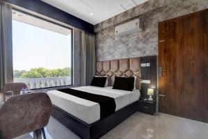 Postel nebo postele na pokoji v ubytování Hotel O RG PALACE HOTEL