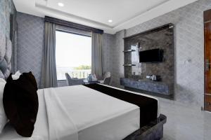 TV a/nebo společenská místnost v ubytování Hotel O RG PALACE HOTEL