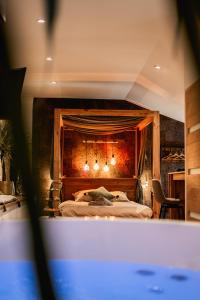Voodi või voodid majutusasutuse Love Room Vendée avec JACUZZI privatif toas