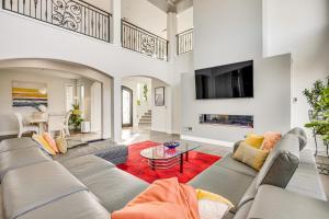 a living room with a couch and a fireplace at Spacious Southern Colorado Home with Mountain Views in Monument
