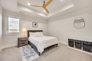 a bedroom with a bed and a ceiling fan at Spacious Southern Colorado Home with Mountain Views in Monument