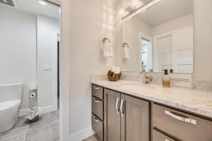 a bathroom with a sink and a toilet at Spacious Southern Colorado Home with Mountain Views in Monument +37 photos