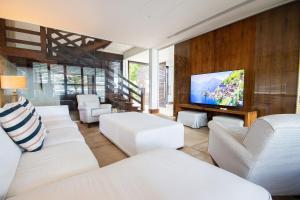 Et tv og/eller underholdning på Casa dos Corais – Pé na Areia by Carpediem