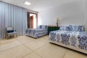 En eller flere senge i et værelse på Casa dos Corais – Pé na Areia by Carpediem