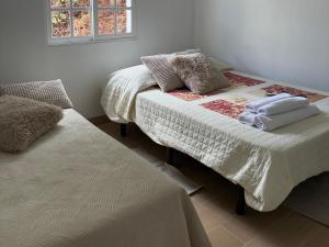 En eller flere senge i et værelse på La Higuerita Slow Home