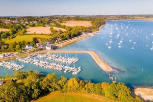 an aerial view of a marina with boats in the water at Appartement MVM Jacuzzi proche Saint-Malo in Plouër-sur-Rance