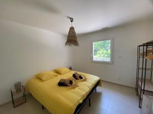 Ένα ή περισσότερα κρεβάτια σε δωμάτιο στο L'ô-De-Là