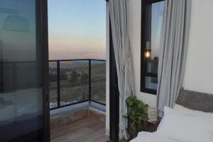 En eller flere senge i et værelse på וילה סירקל - Villa Circle + 52 billeder